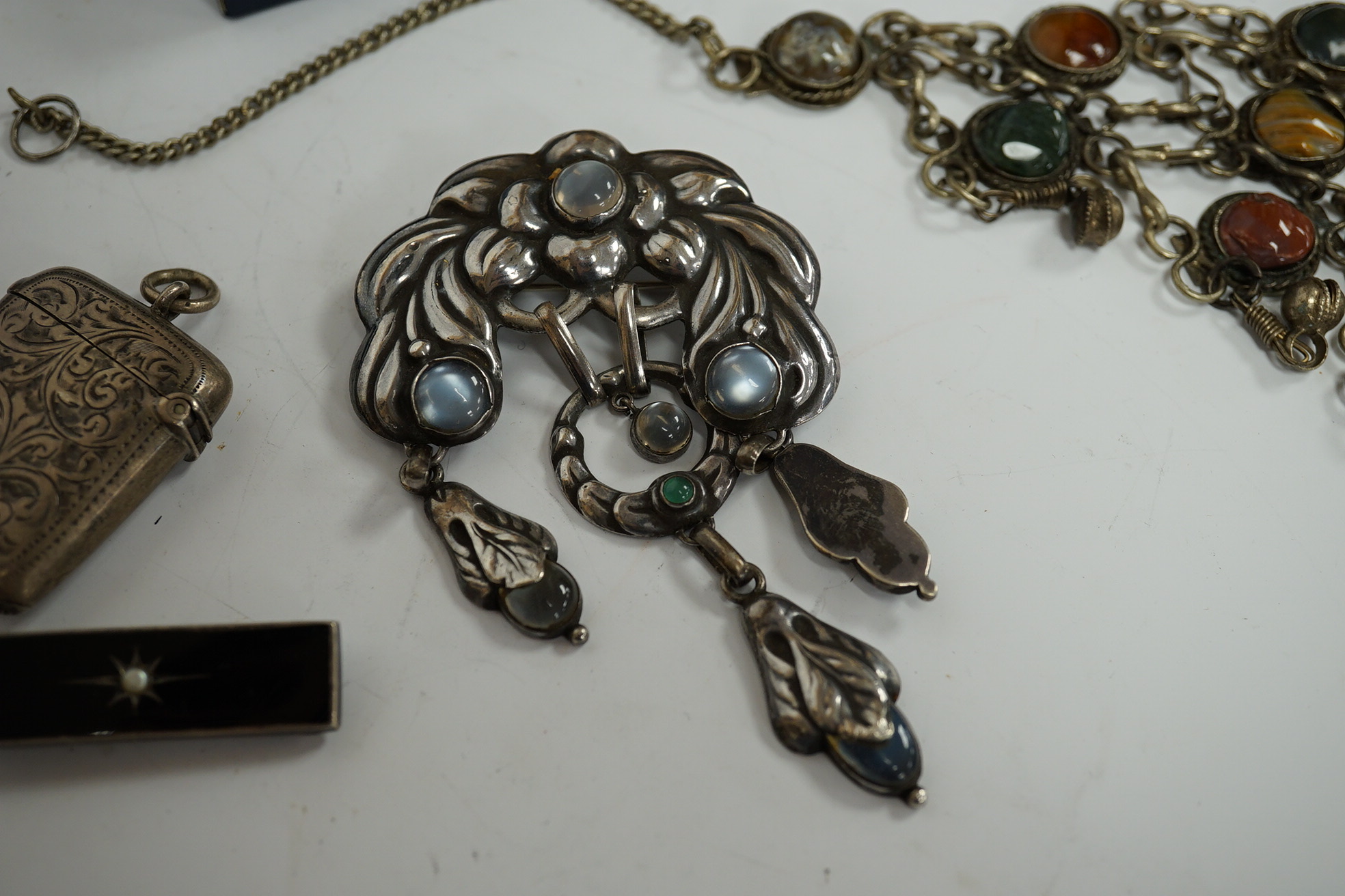 A recent Georg Jensen sterling pendant, 31mm, on a 925 chain, a Norwegian 830S and moonstone cluster set drop brooch, maker VmF, overall 9cm, together with six other items including a boxed Georg Jensen gilt sterling and